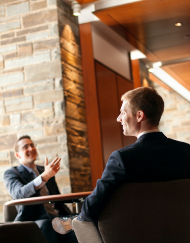 students talking in Hughes Hall