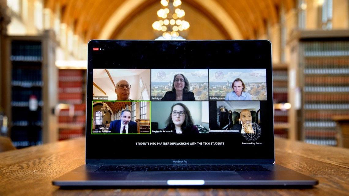 laptop with 6 people on a zoom call