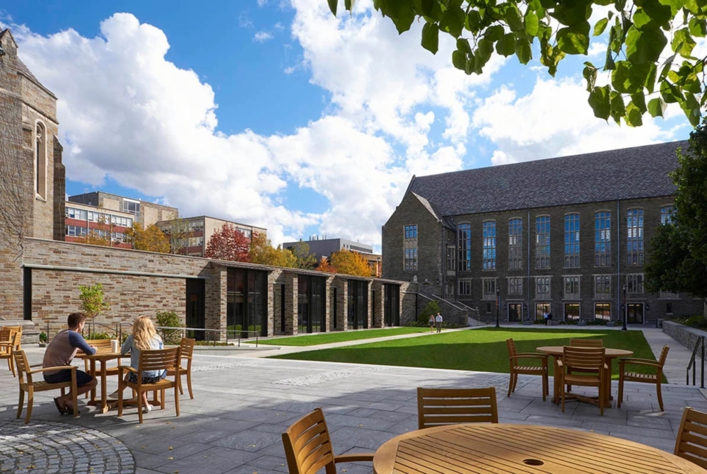 wooden tables in an academic courtyard