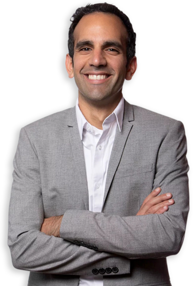 young man in a suit with arms crossed