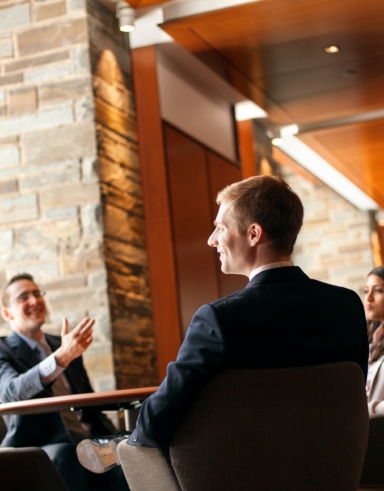 students talking in Hughes Hall