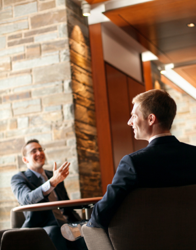 students talking in Hughes Hall