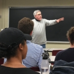 man teaching a class