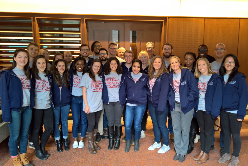 A group of students wearing matching t-shirts