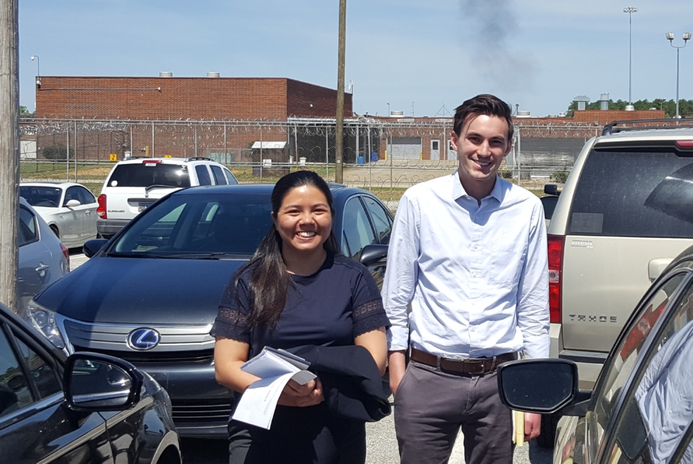 two students outside a prison