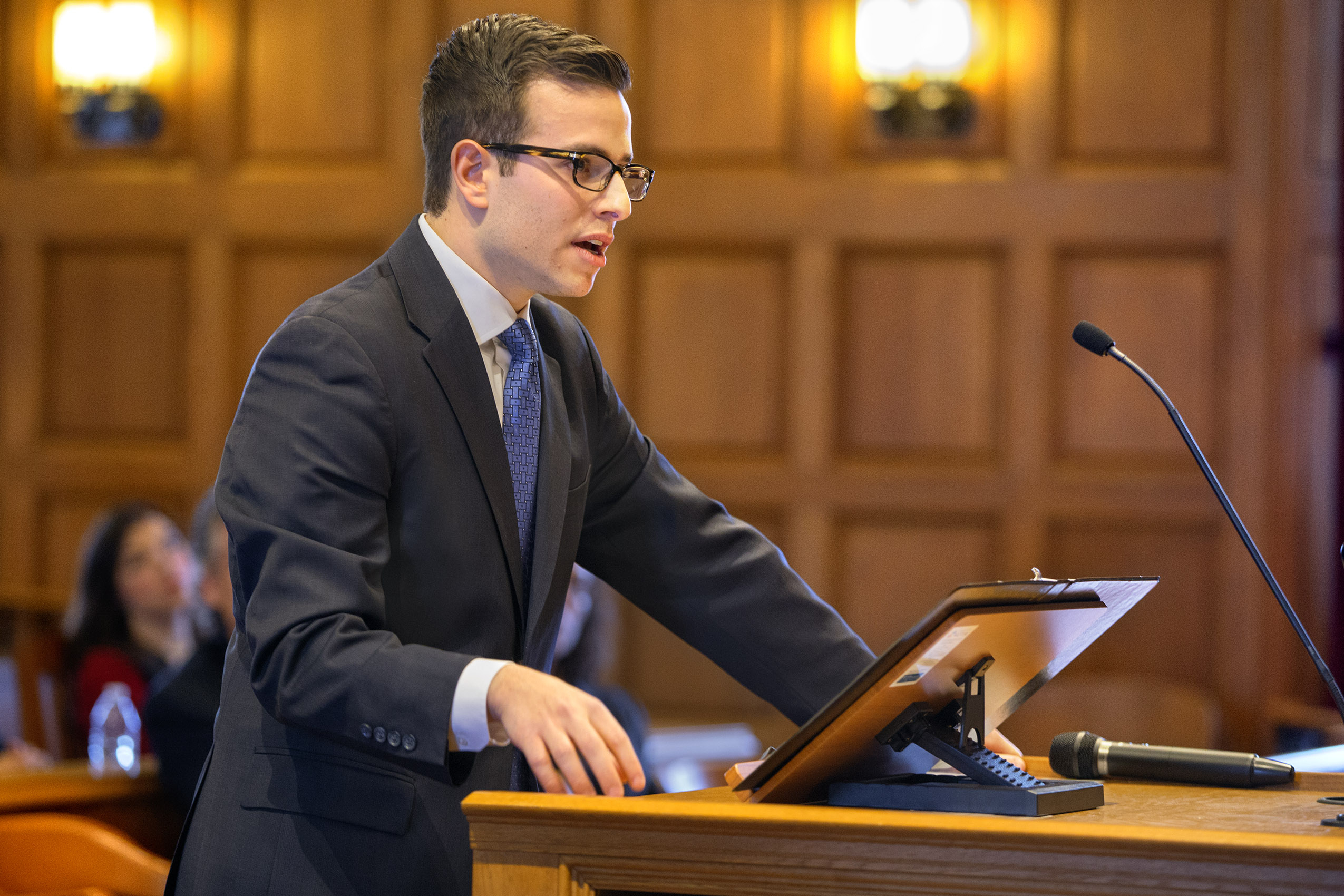 student speaking at a podium