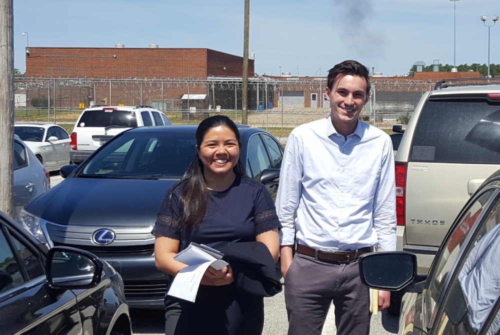 two students outside a prison