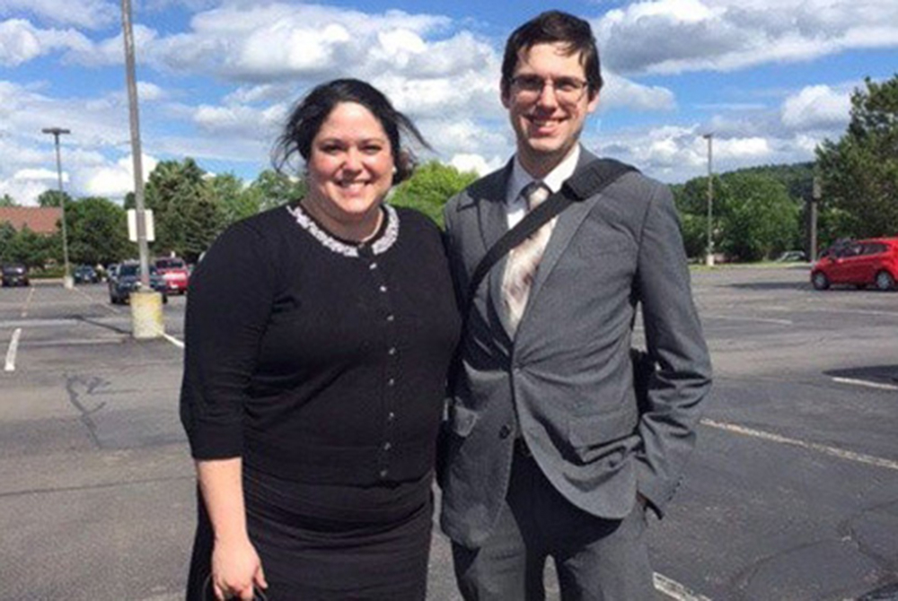 two students in a parking lot