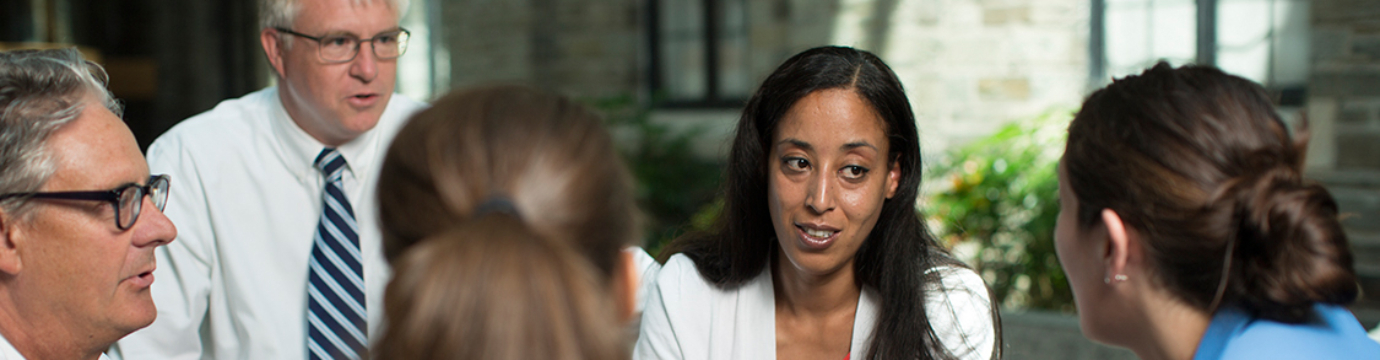 students and faculty in discussion