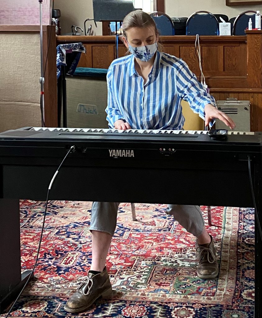 photo of woman playing the piano