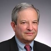 Nicholas Rostow on gray background
