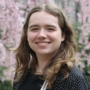 Courtney Dalton outdoor, pink flowering tree in background