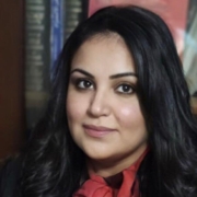 Radwa Elsaman on background of books.