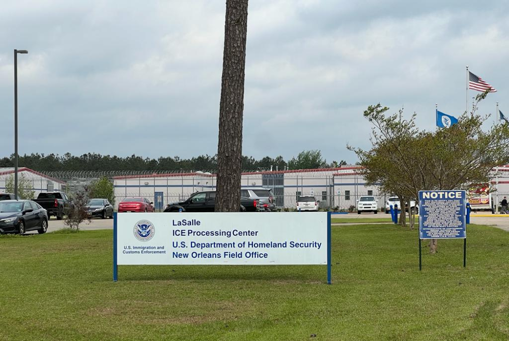 A large white sign for the LaSalle ICE Processing Center U.S. Department of Homeland Security New Orleans Field Office