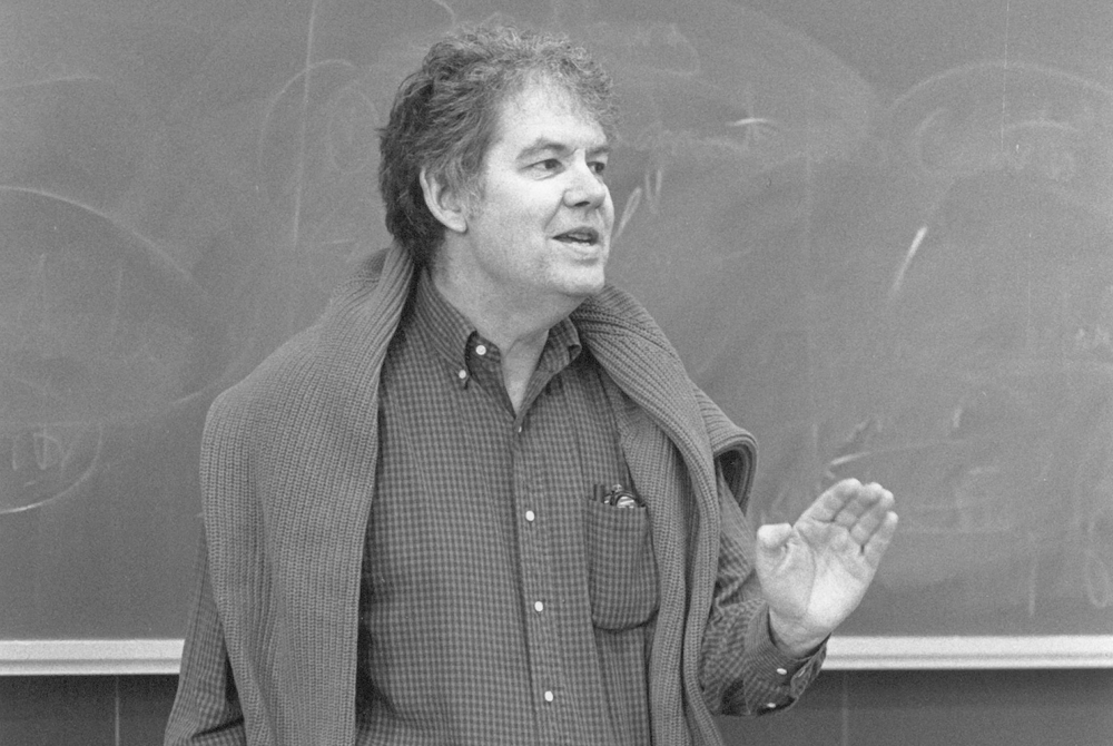 Black and white photo of Steve Shiffrin lecturing in front of a classroom.