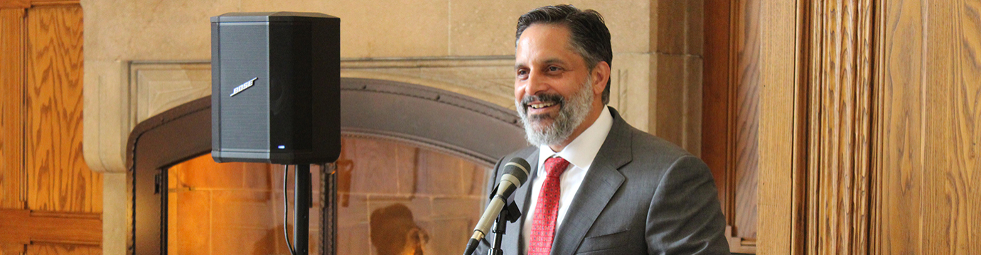 Former Dean Eduardo Peñalver speaking at a lectern