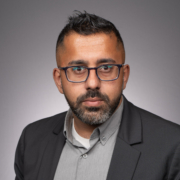Gautam Hans on gray background