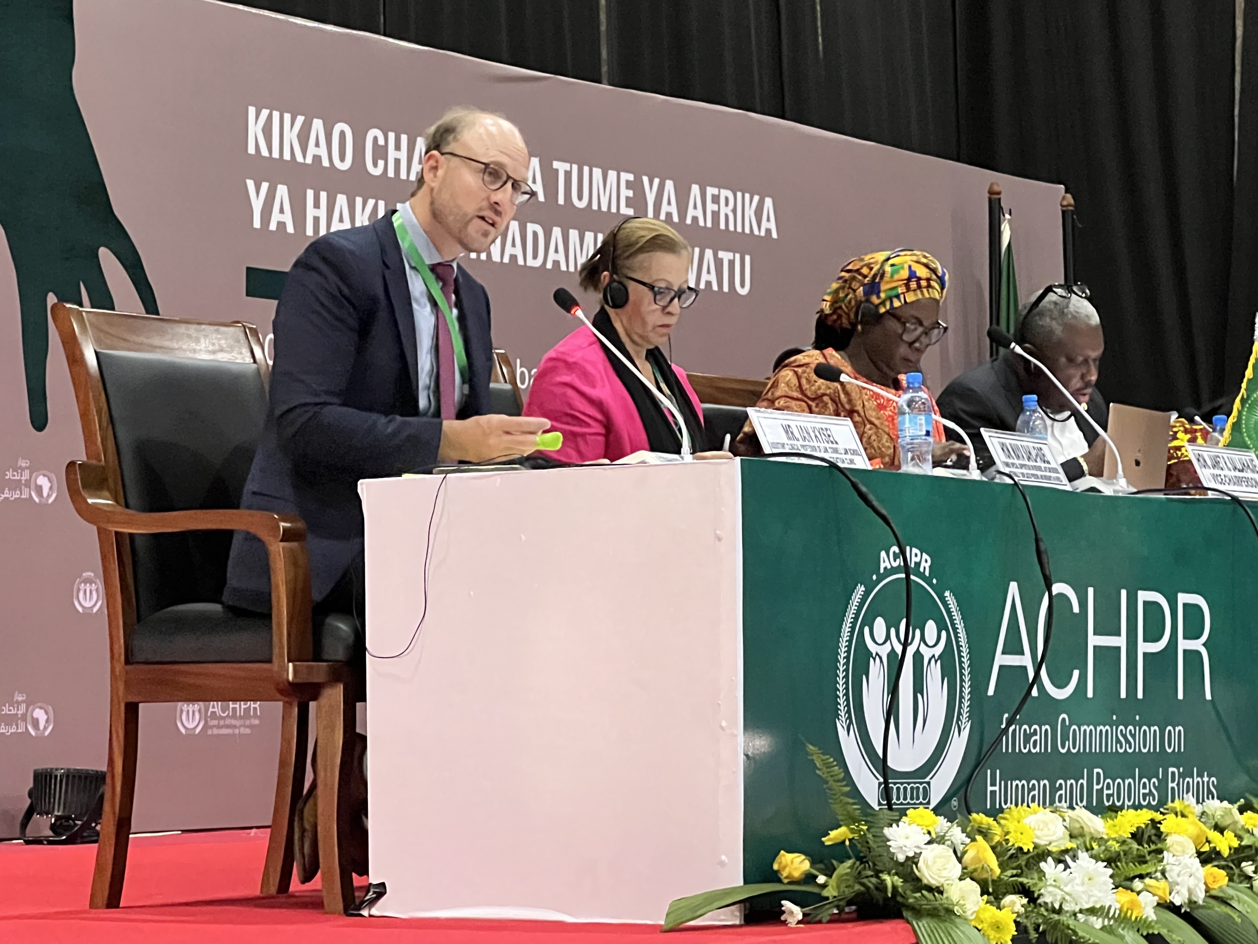 a panel of speakers at an event