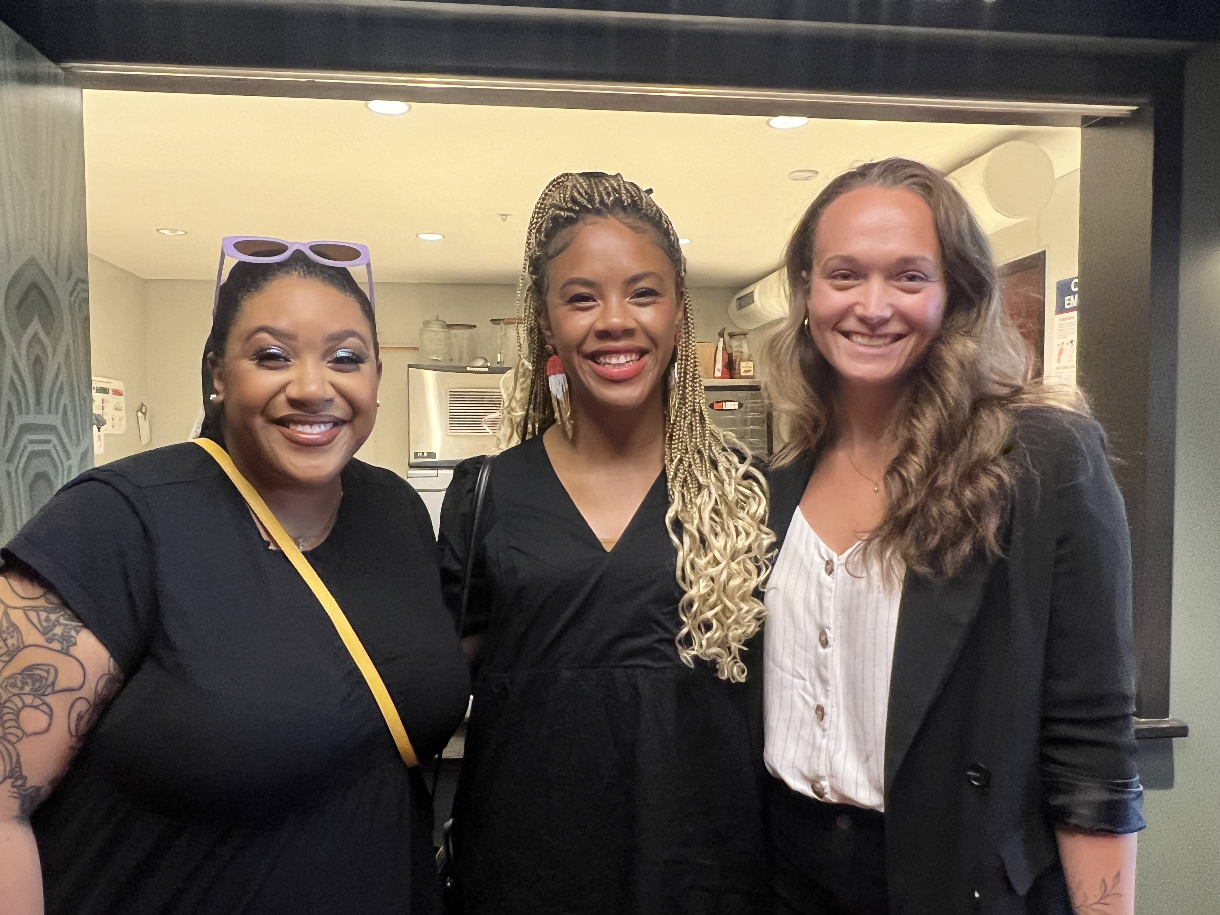 this is an image of the filmmaker (pictured right) and two others at the premiere of the film