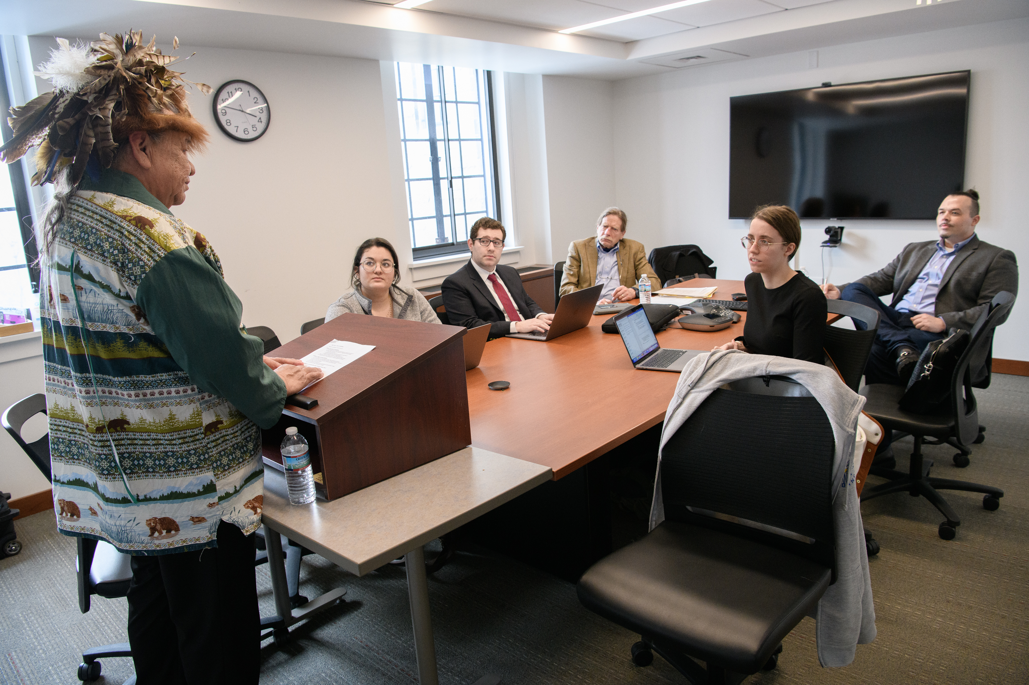 Sam George, a member of the Cayuga Nation and client of the Federal Indian Law Practicum, meets with the class. From left: George, Danica Murthy '24, ??, Adjunct Professor Joe Heath, Erin Elliott '24, and Adjunct Professor Michael Sliger.