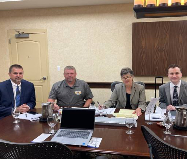 Cole Quigley ’25, who handled the hearing, pictured here at right with Professor Angela Cornell and the two clients.