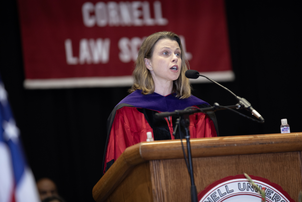 a faculty member addressing the crowd at the ceremony