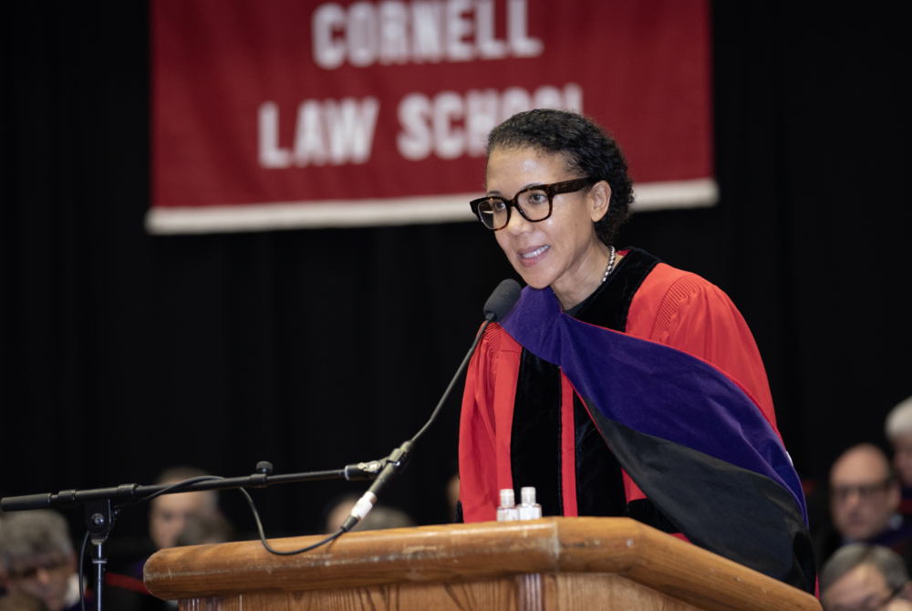 a faculty member addressing the crowd at the ceremony
