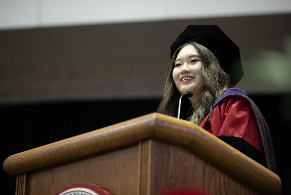 LLM student speaker giving speech at graduation