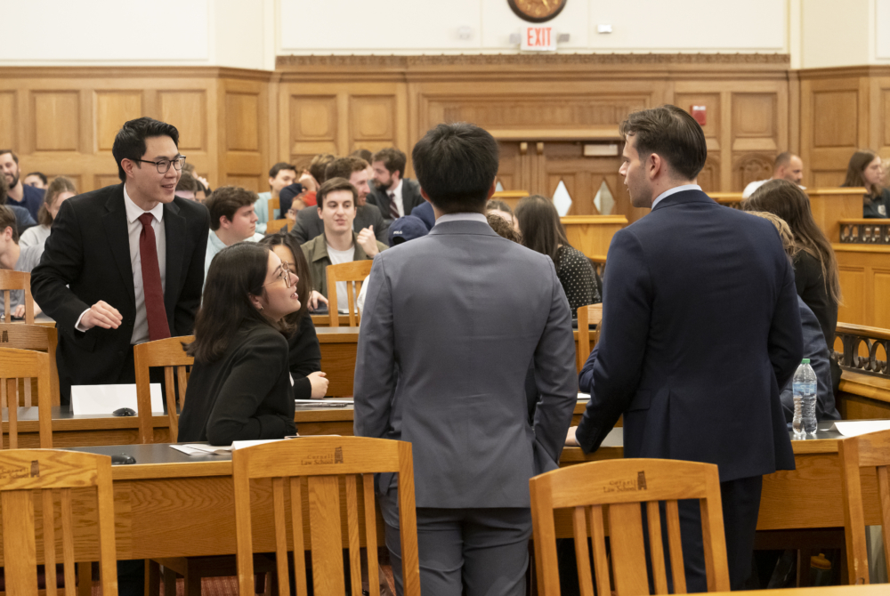 Students talking during moot court competition.