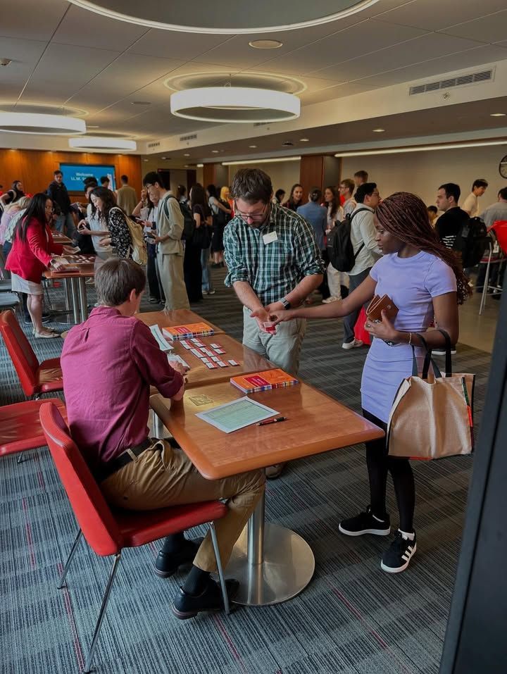 2 CLS staff helping llm student with registration
