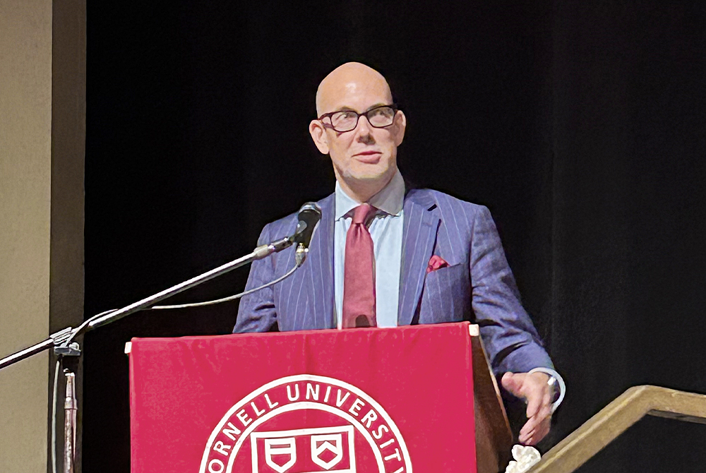 Dean Ohlin speaking at podium