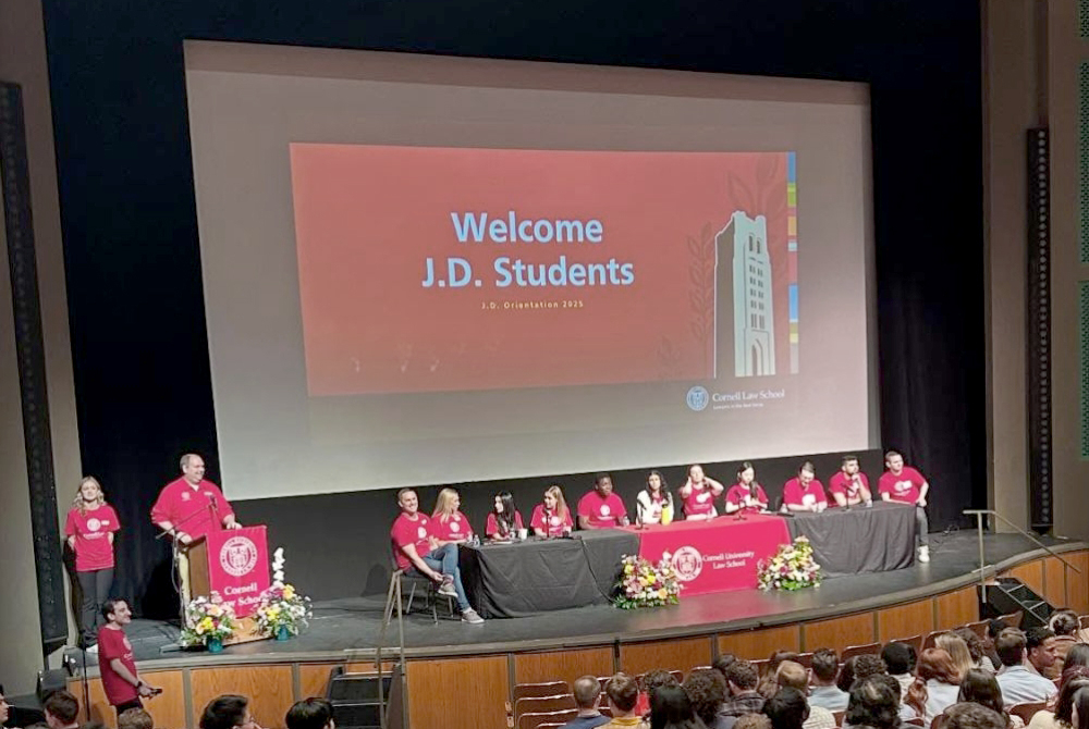 group of students presenting onstage at orientation