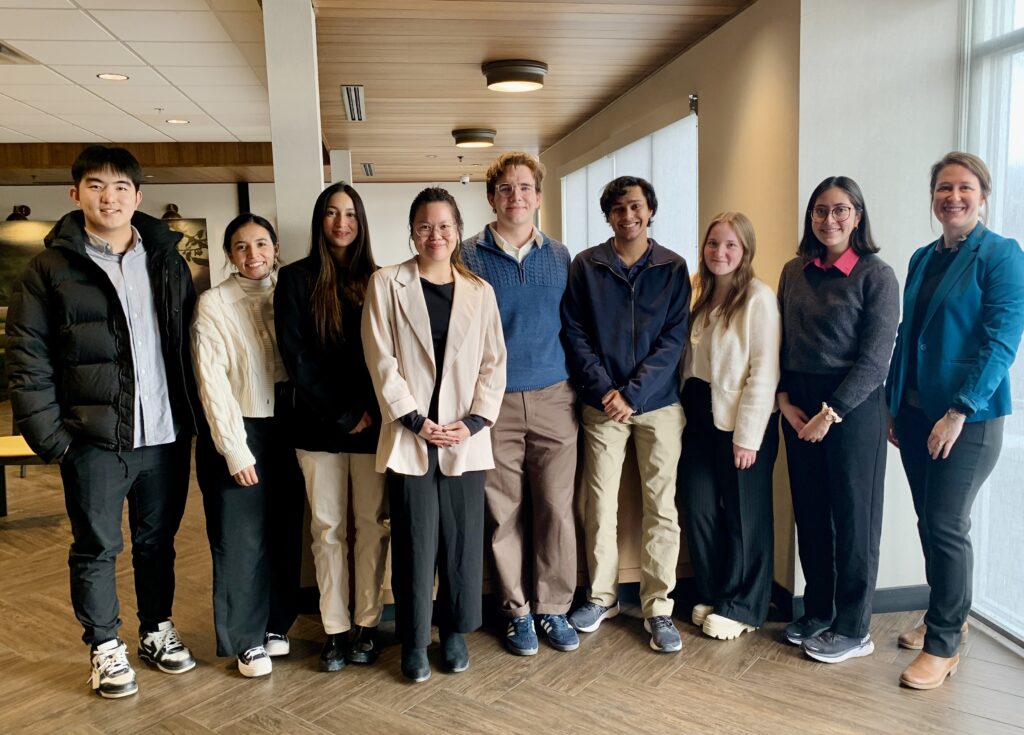 group shot of students with professor kelley-widmer