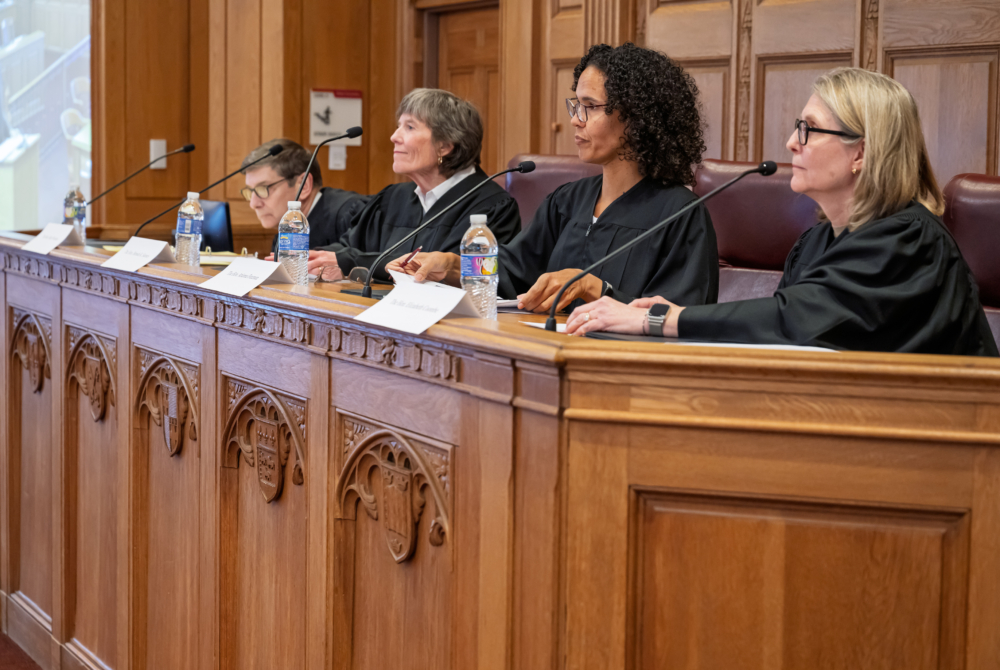 esteemed panel of judges for 2026 rossi moot court competition sitting at bench