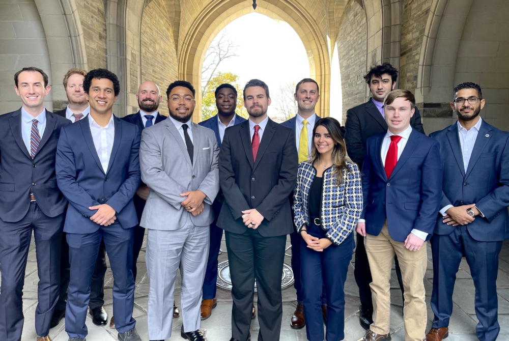 Estefania Solis '27 and other students posing for photo outside of Cornell Law School