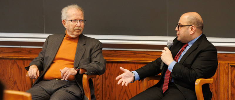 Devin Flores/Cornell University At right, Mohamed ‘Arafa, adjunct professor of law, talks with Menachem Z. Rosensaft, adjunct professor of law, about “The Urgency of Jewish-Muslim Dialogue” April 14 in Myron Taylor Hall at Cornell Law School.