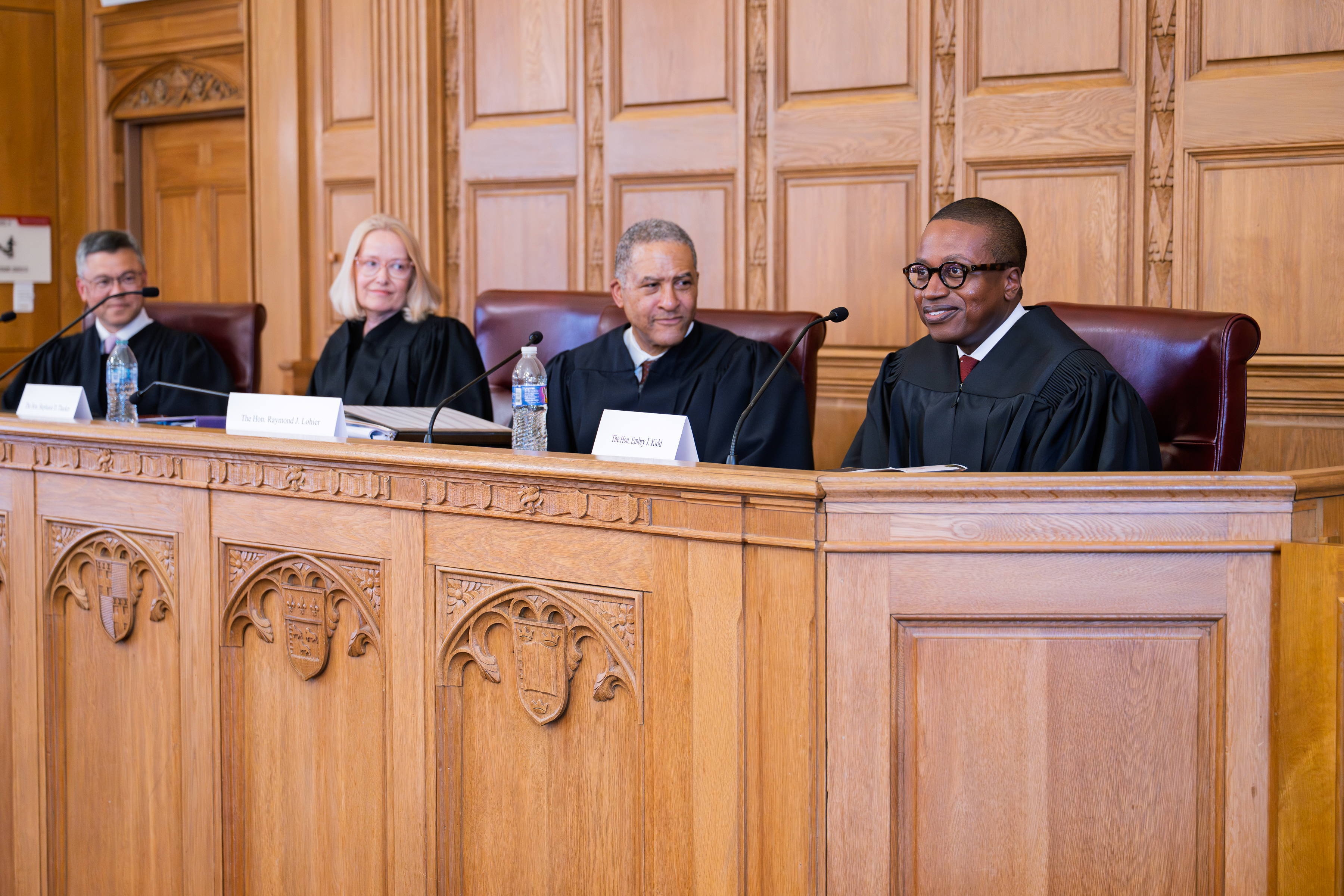 The Hon. Embry Kidd and the other panelists share feedback with the finalists at the conclusion of the competition.