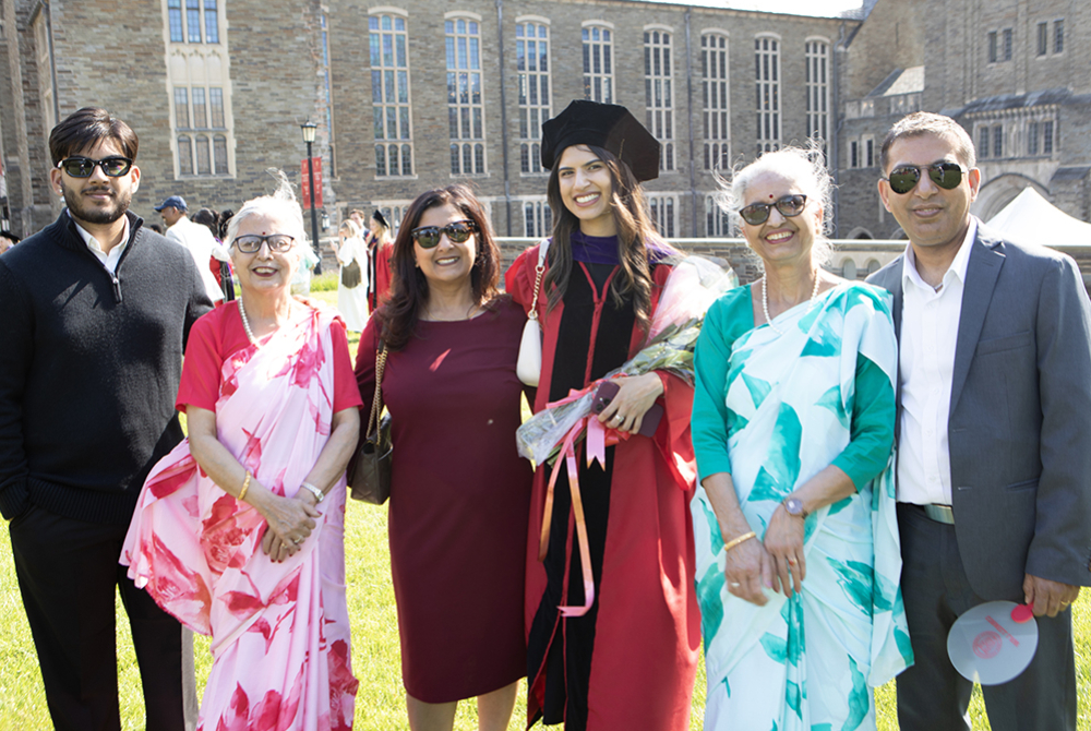 Graduate with family at Convocation.