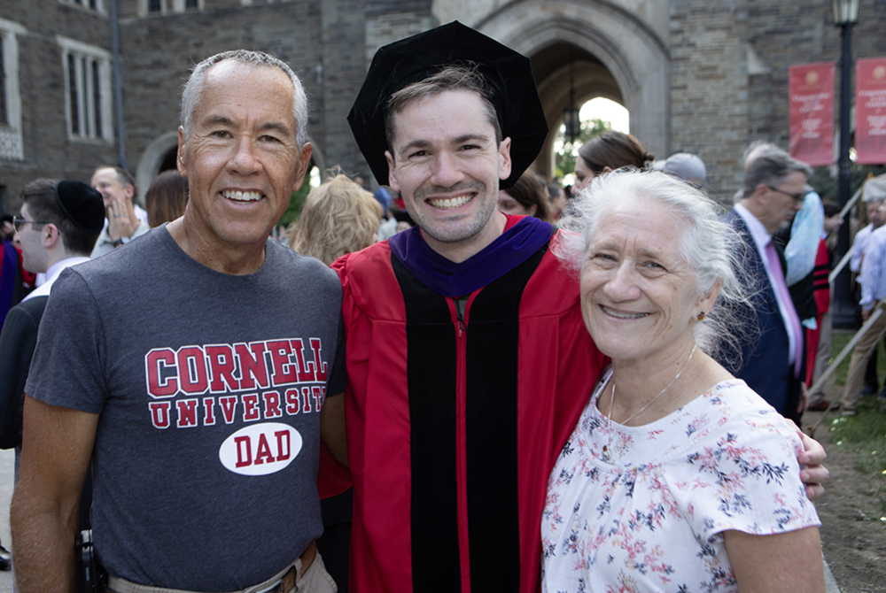 Graduate with their family outside.