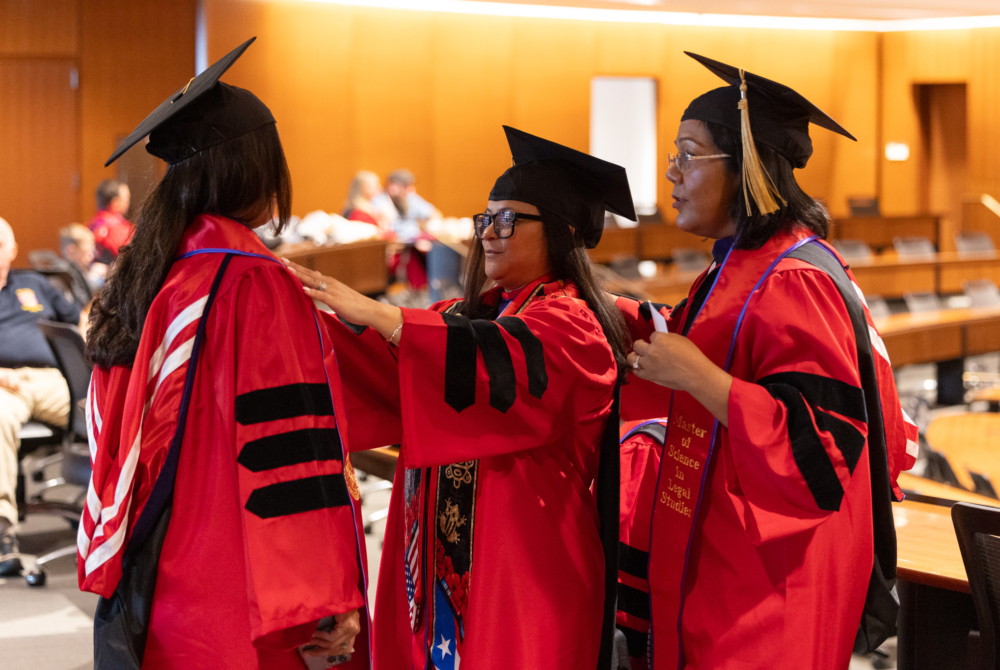 Graduates getting ready before the ceremony.