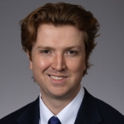 Robert MacKenzie on gray background.